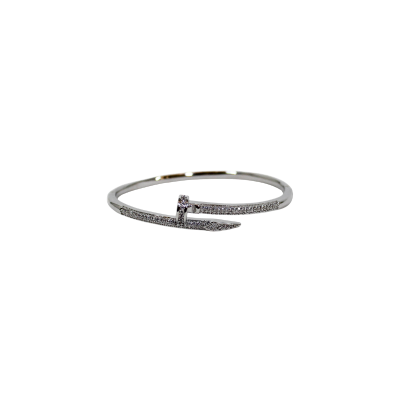 Silver nail bangle bracelet on a white background