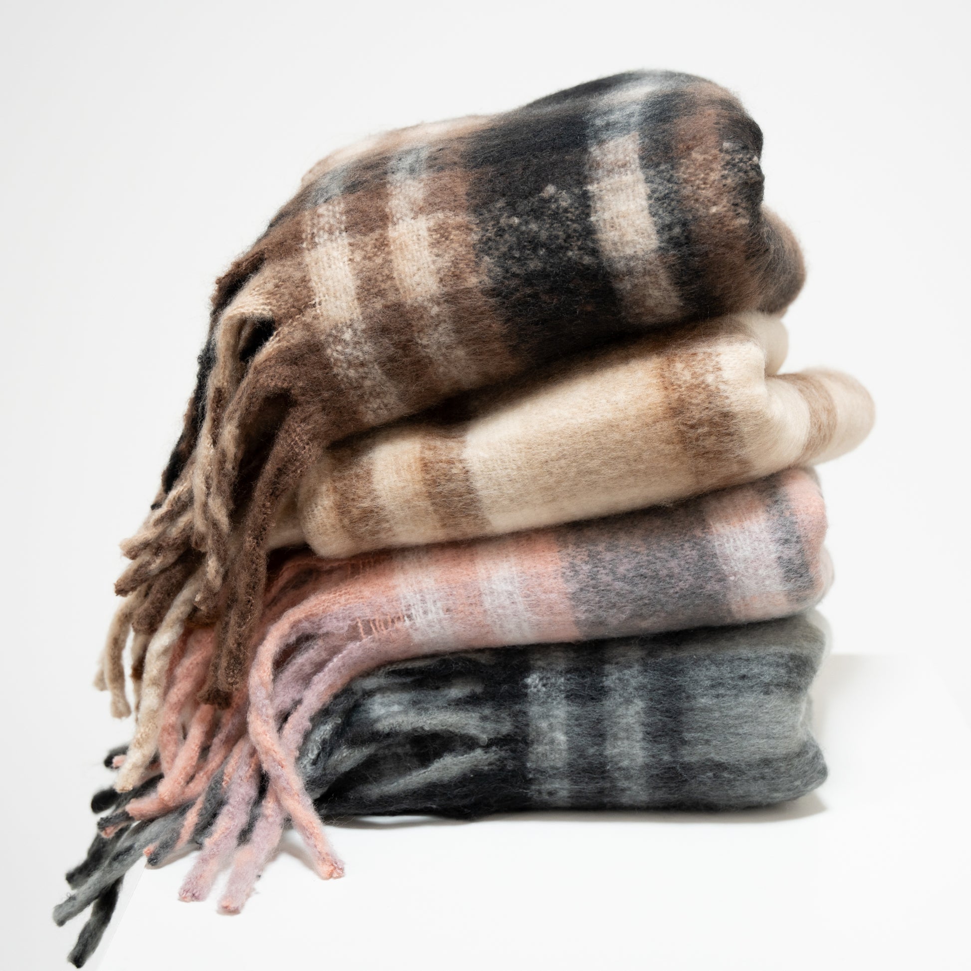 stack of plaid scarves