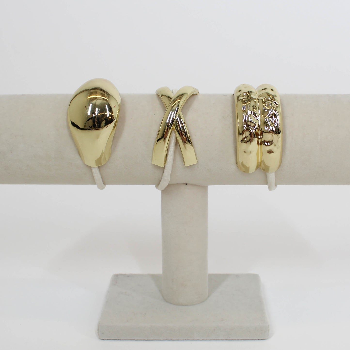 tan hair ties with gold details