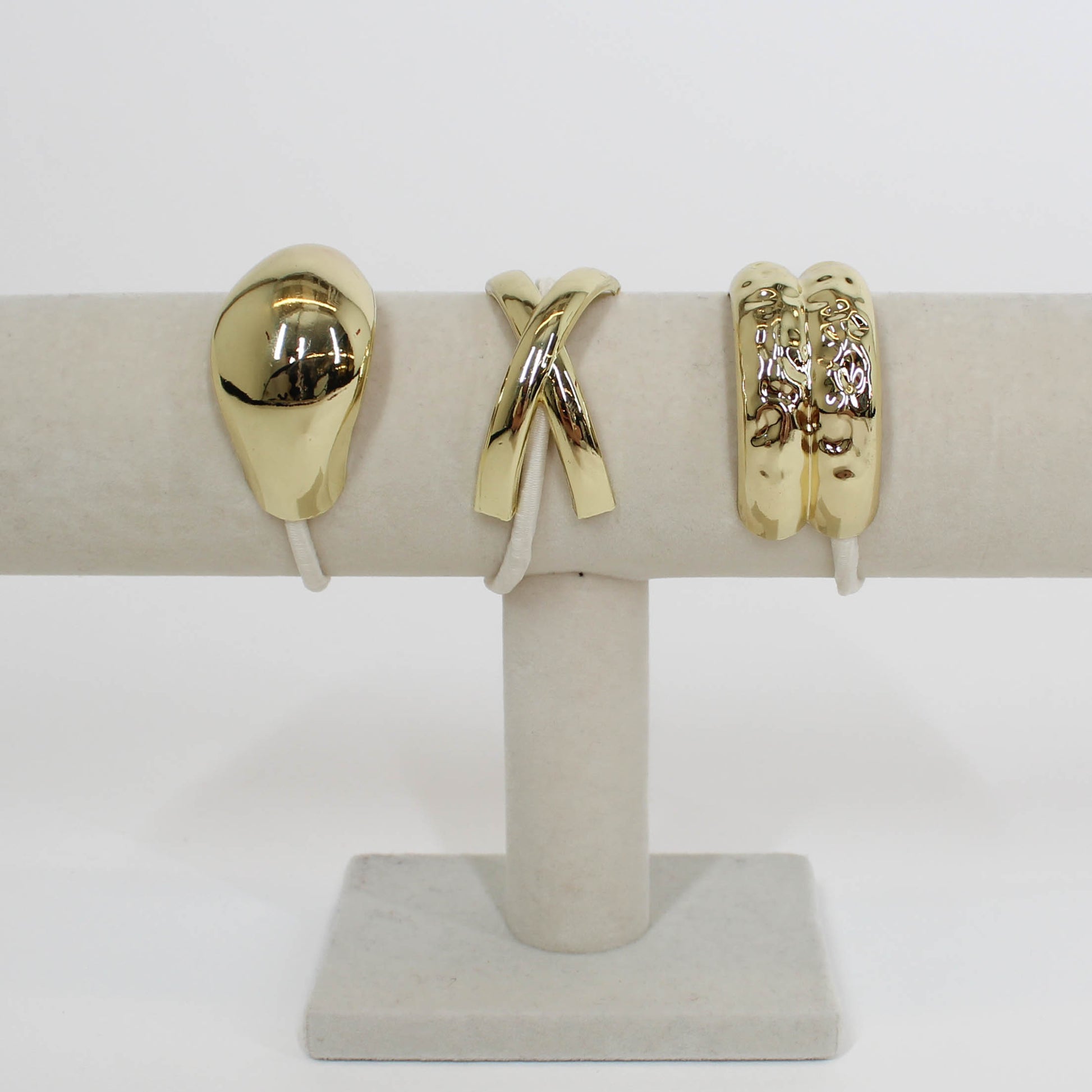tan hair ties with gold details