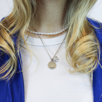 Silver scripted M Disc Necklace for Marist on model 
